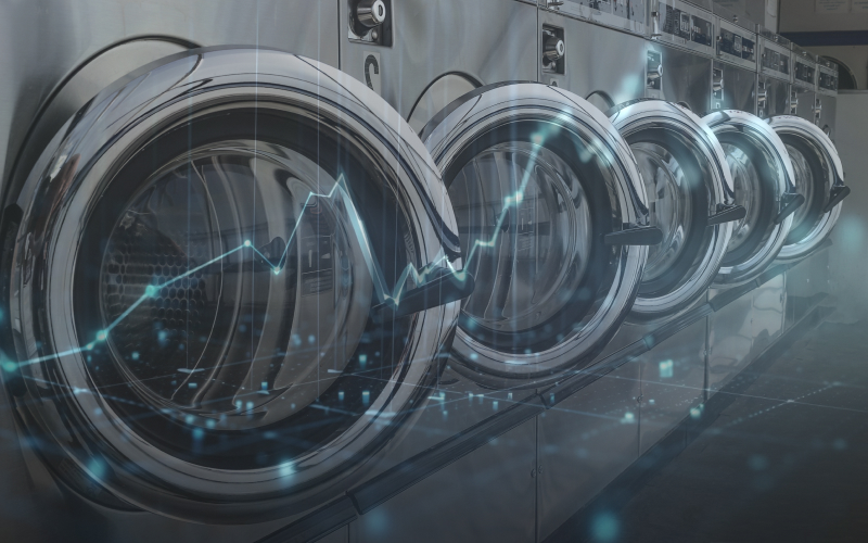 Commercial washing machines overlaid with a rising market growth graph.